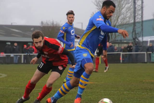 James Brighton challenges as Basingstoke player during Kettering's victory
