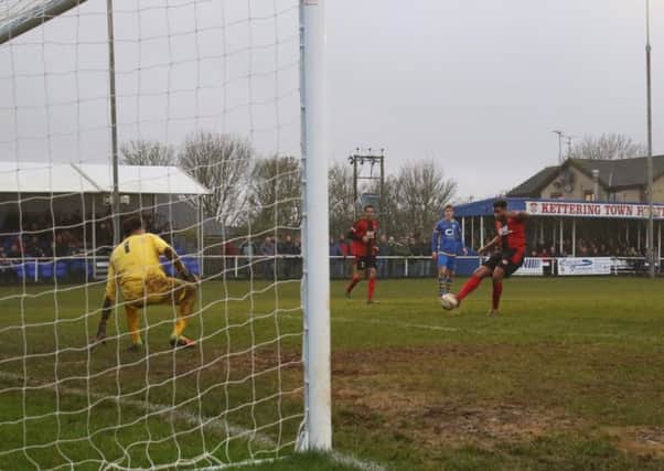 Rene Howe scores Kettering Town's second goal in their 2-1 win over Basingstoke Town. Pictures by Peter Short