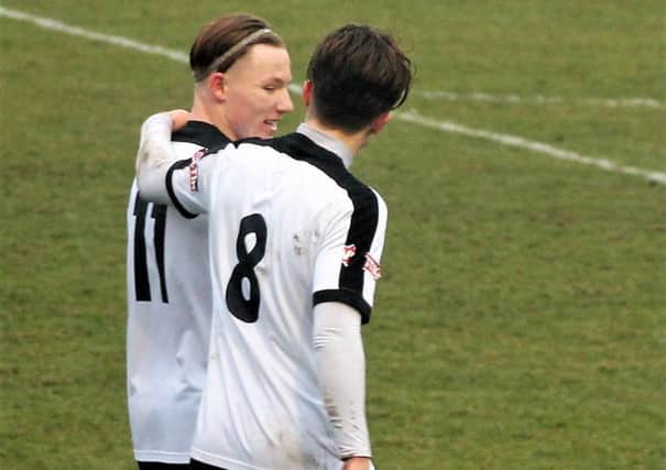 Ben Milnes celebrates his winning goal with Jordon Crawford during Corby Town's 2-1 success at Matlock Town last weekend