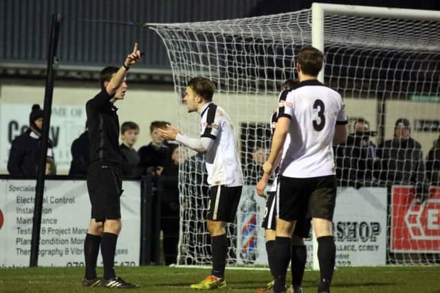 Ben Milnes argues the point after referee Daniel Hanna booked him for diving after a challenge in the penalty area during Corby Town's 0-0 draw with Warrington Town. Pictures by Alison Bagley