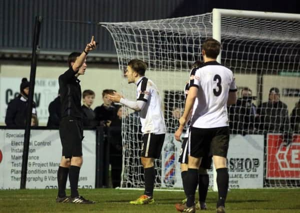 Ben Milnes argues the point after referee Daniel Hanna booked him for diving after a challenge in the penalty area during Corby Town's 0-0 draw with Warrington Town. Pictures by Alison Bagley