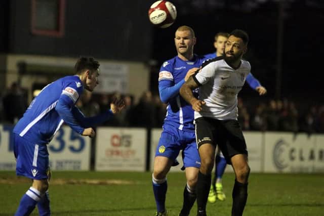 Aaron Brown challenges for the ball during the Steelmen's goalless draw