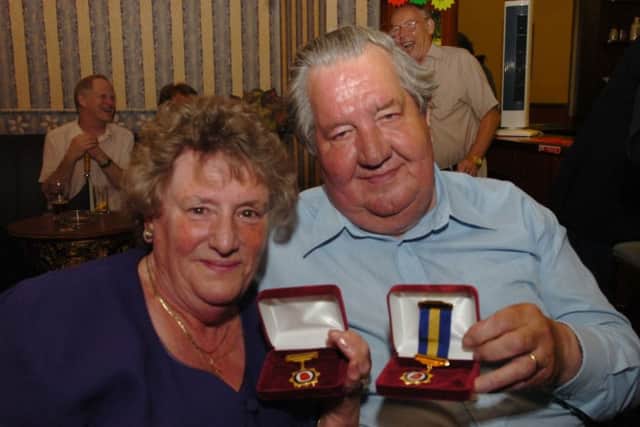 Pat and Derek Taylor receiving awards from the RBL in 2007