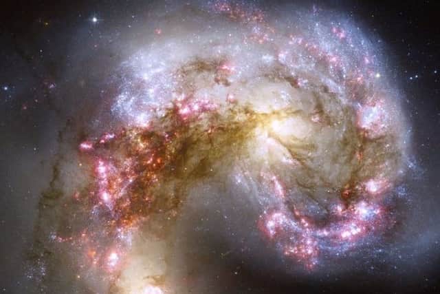 This is what a collision of galaxies looks like (Photo credit: NASA)