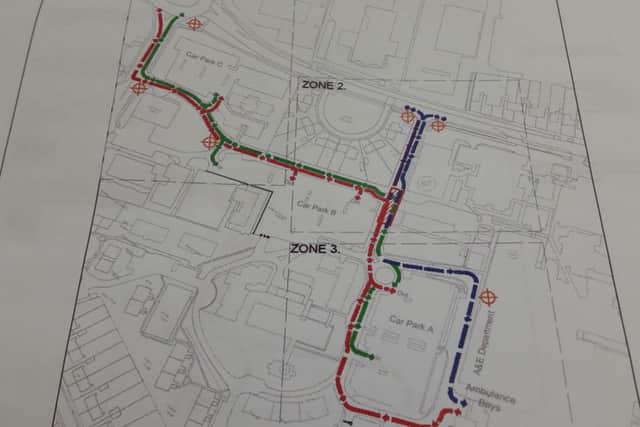 The red and green lines show access in an out for normal vehicles, with blue and purple lines showing emergency routes. NNL-170117-164852005