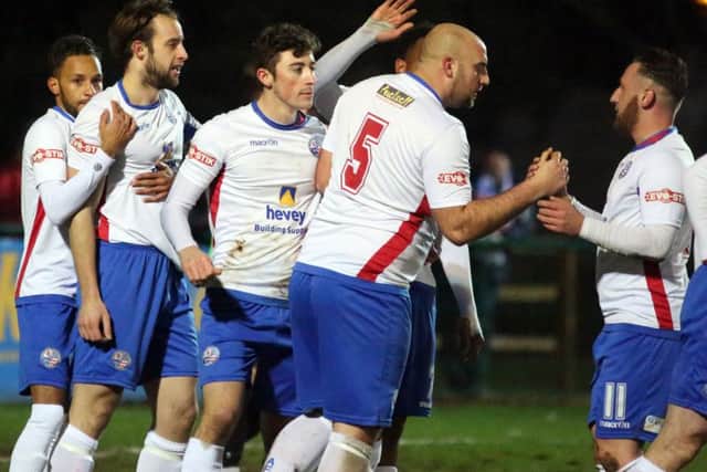 AFC Rushden & Diamonds' players celebrate Tom Lorraine's goal during the 3-0 success over Rugby Town. Picture by Alison Bagley