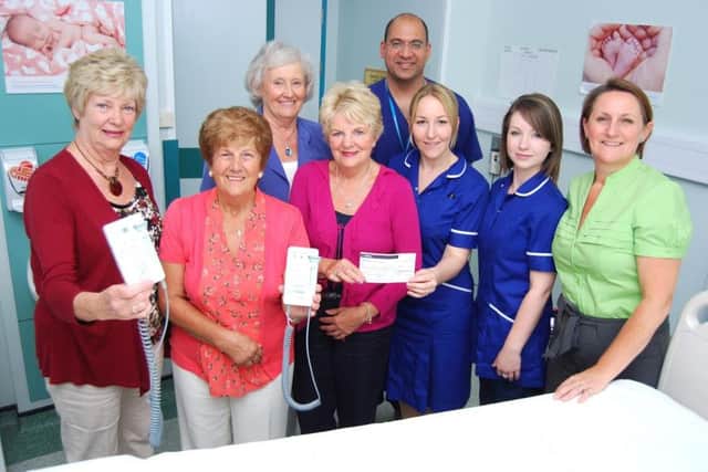 In August 2012 the League of Friends present Doppler machines to staff in the maternity unit