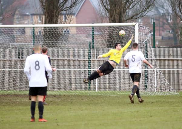 Remy Brittain scores one of Whitworth's goals during the 2-2 draw with Bugbrooke in UCL Division One last weekend. Pictures by Alison Bagley