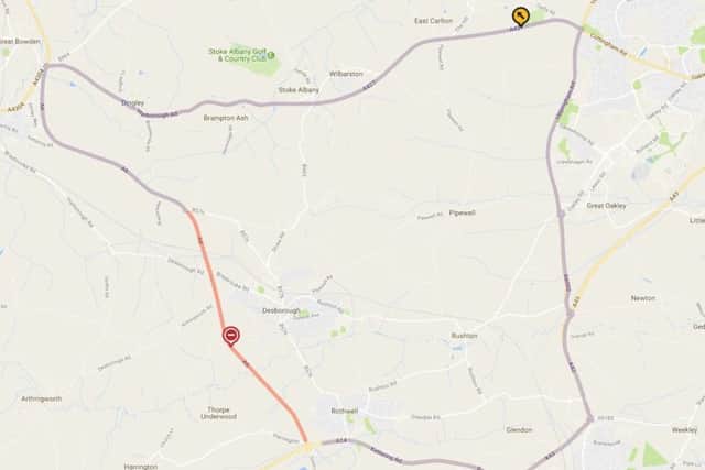 The section of the A6 which is closed, in red, and the official diversion route in purple