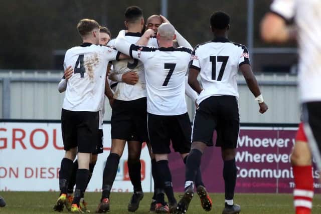 Corby Town celebrate Aaron Brown's late winner at Steel Park. Pictures by Alison Bagley