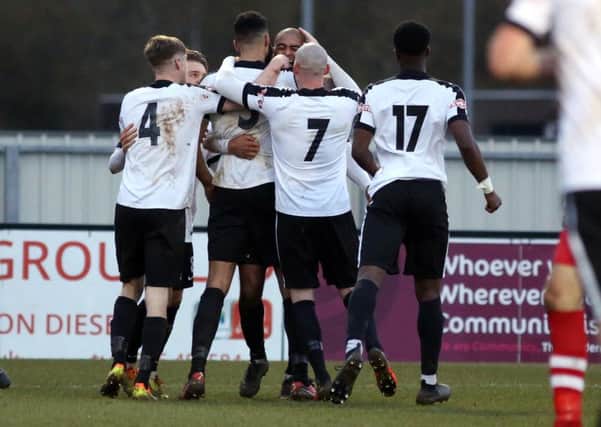 Corby Town celebrate Aaron Brown's late winner at Steel Park. Pictures by Alison Bagley