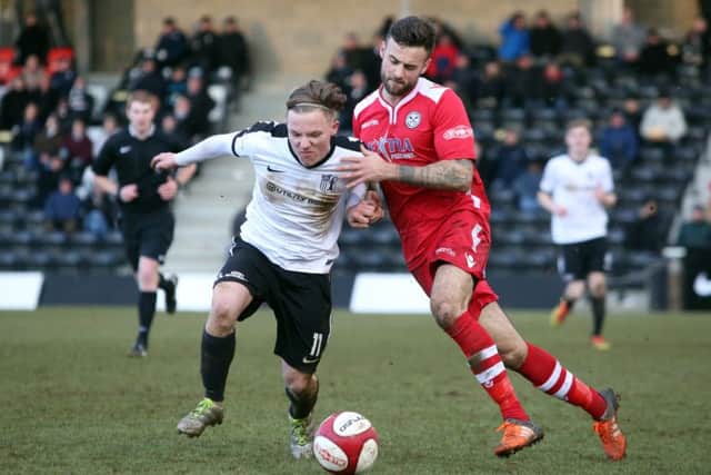 Jordon Crawford battles for possession