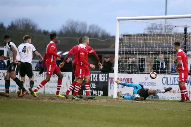Aaron Brown scores Corby Town's winner in the 3-2 victory over Hednesford Town at Steel Park. Pictures by Alison Bagley