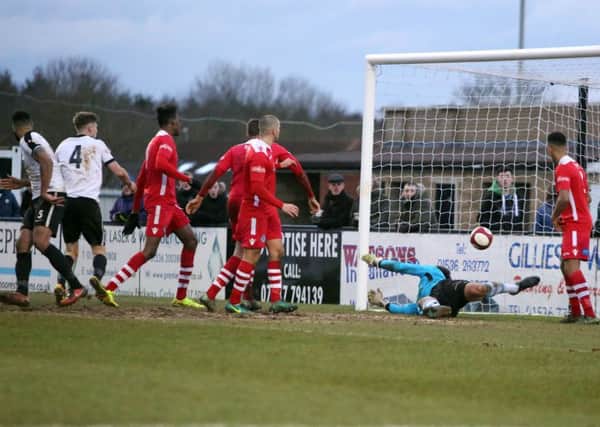 Aaron Brown scores Corby Town's winner in the 3-2 victory over Hednesford Town at Steel Park. Pictures by Alison Bagley