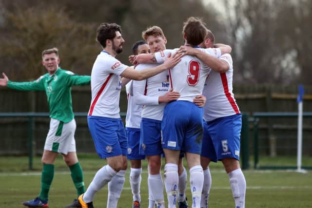 Tom Lorraine takes the congratulations after scoring his goal for Diamonds