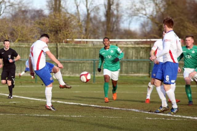Joe Curtis scores his and AFC Rushden & Diamonds' second goal during the 4-0 victory over Loughborough Dynamo. Pictures by Alison Bagley