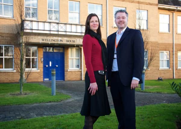 Debbie Fourie and Neil Orton from Vizion Network outside the new office in Wellingborough