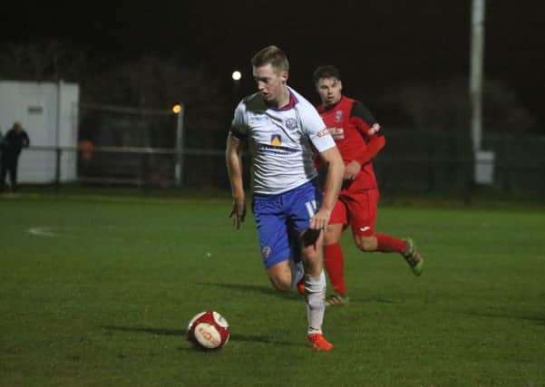 Jake Newman scored the decisive penalty in AFC Rushden & Diamonds' shoot-out success over Spalding United