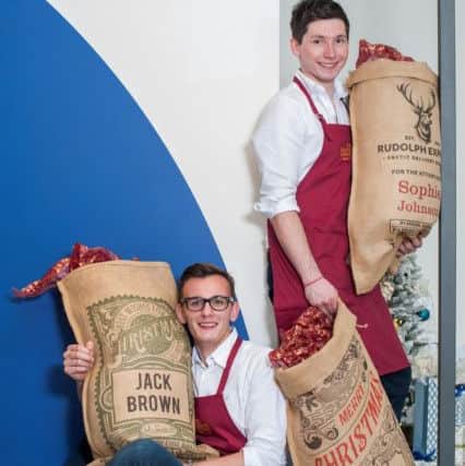 Louis and Tom with the gift sacks