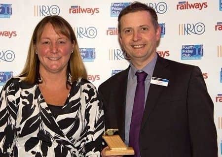 Ian Smith collects the award.