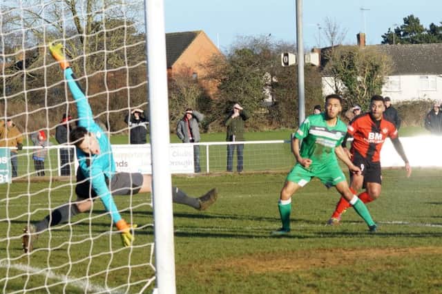 Rene Howe scores the Poppies' second goal against Biggleswade