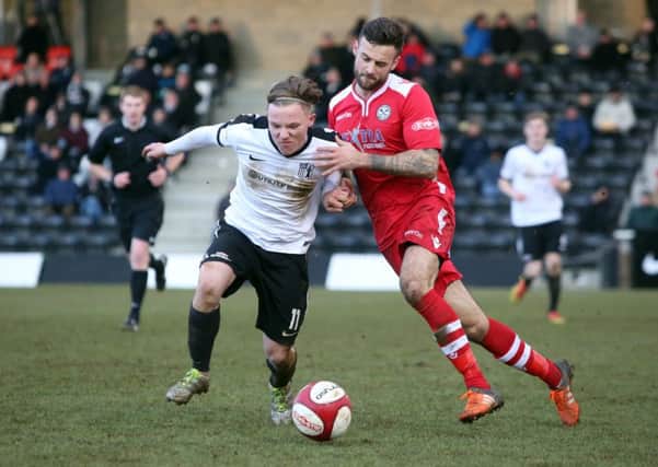 Jordon Crawford gave Corby Town an early lead as they claimed a vital 2-0 win at Frickley Athletic