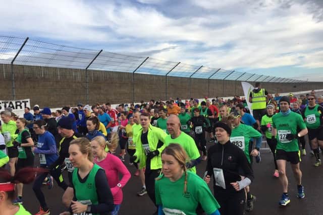 Runners take on the famous oval circuit.