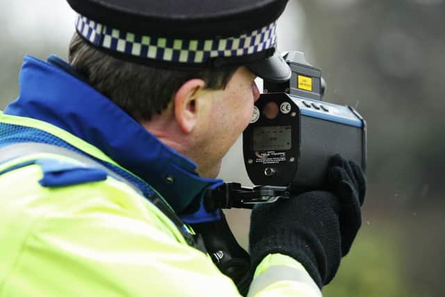 A PCSO using a speed gun in Northamptonshire ENGNNL00120120131153132