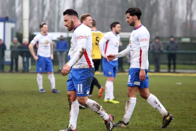 Joe Curtis heads for the dressing-room after being sent-off during AFC Rushden & Diamonds' 0-0 draw with Belper Town. Pictures by Alison Bagley