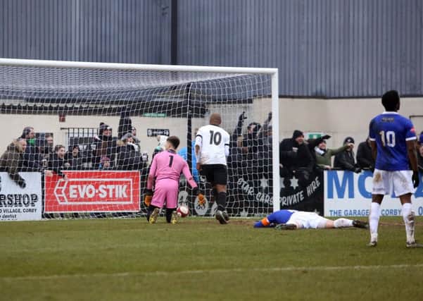 The Corby Town fans celebrate Ben Milnes' winning goal at Steel Park. Pictures by Alison Bagley