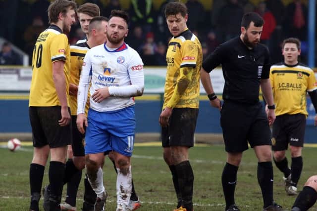 Joe Curtis begins the long way to the dressing-room after he was shown a red card
