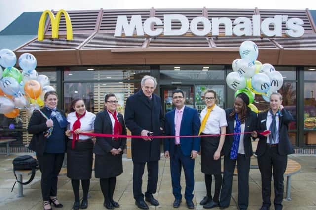 Peter Bone cutting the ribbon at the official re-opening