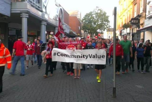 Poppies fans march on the council in protest.