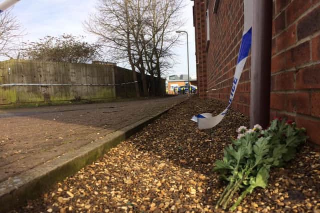 The police cordon in the alleyway has been taken down.