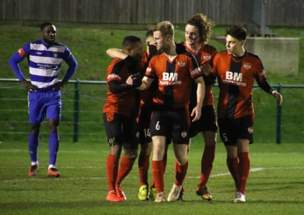 Aaron O'Connor takes the congratulations after scoring one of his two goals in Kettering Town's 3-2 victory at Dunstable Town. Picture by Peter Short