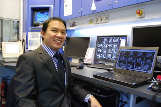 Dr Adrian Cheng pictured in the cardiac MRI scanning control room.