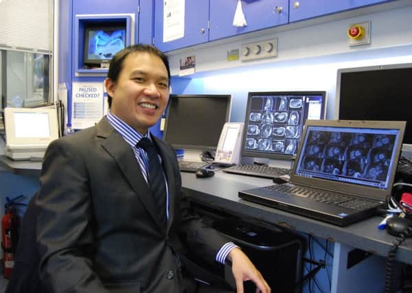 Dr Adrian Cheng pictured in the cardiac MRI scanning control room.