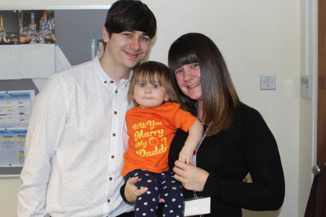The happy couple with daughter Evelyn