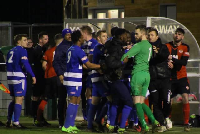 Tempers flare between the two sets of players at the end of Kettering Town's 3-2 win at Dunstable Town on Tuesday night. Picture by Peter Short