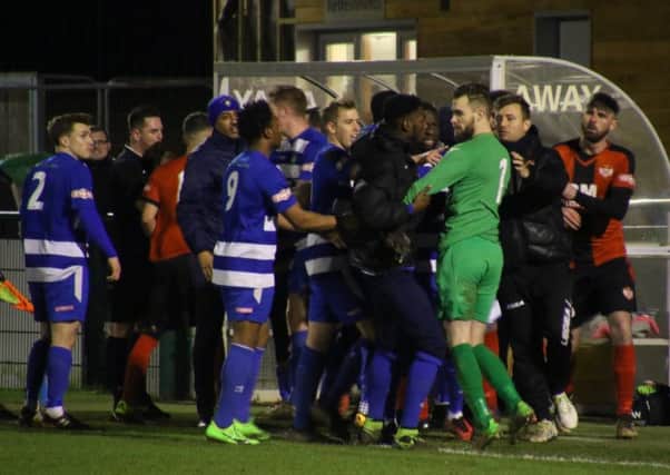 Tempers flare between the two sets of players at the end of Kettering Town's 3-2 win at Dunstable Town on Tuesday night. Picture by Peter Short