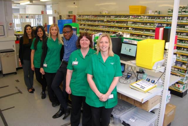 some of the KGH Pharmacy team in the hospitals old storage and dispensing area