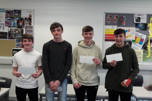 L-R: Adam, Ryan, Liam and Harry with their vouchers.