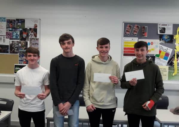 L-R: Adam, Ryan, Liam and Harry with their vouchers.