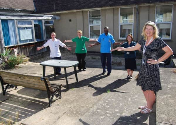 Service support manager Jayne Chambers and ward staff Paul Horsely, Lindsay Parsler, Jonas Donkor and Carol Blackley in the existing courtyard.