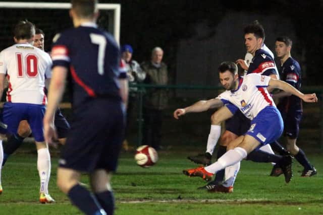 Tom Lorraine has a shot on goal for Diamonds