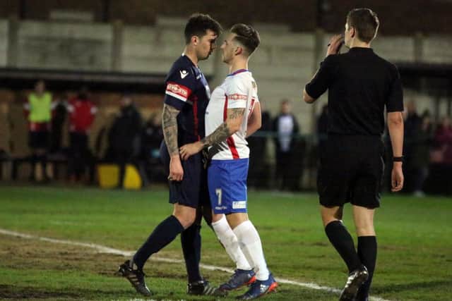 Diamonds' Ben Ford squares up to a Witton opponent