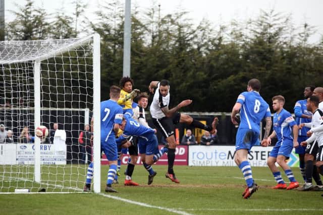 Aaron Brown rounded off Corby Town's 5-1 victory over Sutton Coldfield Town with this late header. Pictures by Alison Bagley