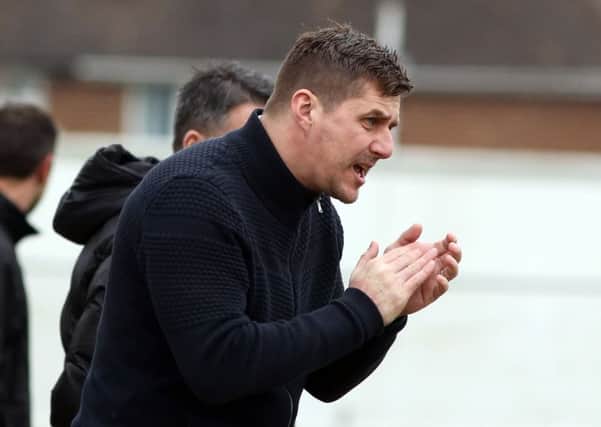 Marcus Law encourages his Kettering Town team during their 1-1 draw with St Ives Town. Pictures by Alison Bagley
