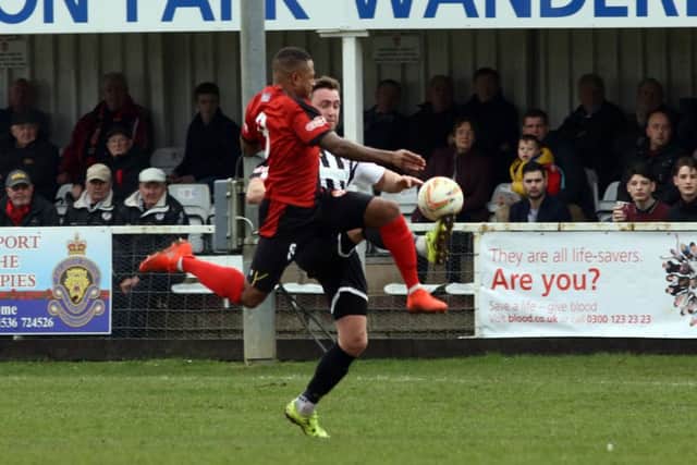 Aaron O'Connor, who grabbed Kettering's equaliser, challenges a St Ives opponent