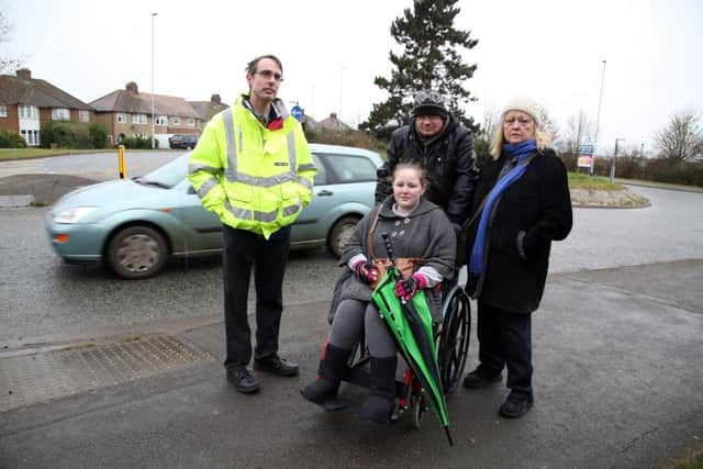 Pedestrian Cross: Desborough: resident Marianne Lendrum who uses buses meets with highways officials to discuss getting a safe crossing to the bus stop in Harborough Road. 
l-r Mathew Barber (Northamptonshire Highways), Danielle Page, Taz Page and Marianne Lendrum
Tuesday February 28 2017 NNL-170228-195902009